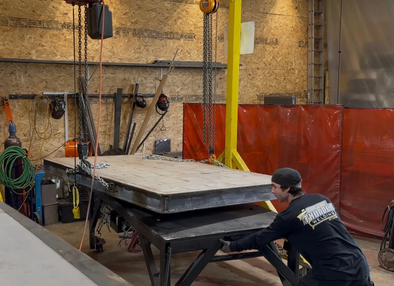 Rigging a 5,000 lb door on the gantry with chain hoists - the only way to move and work weldments this heavy.
