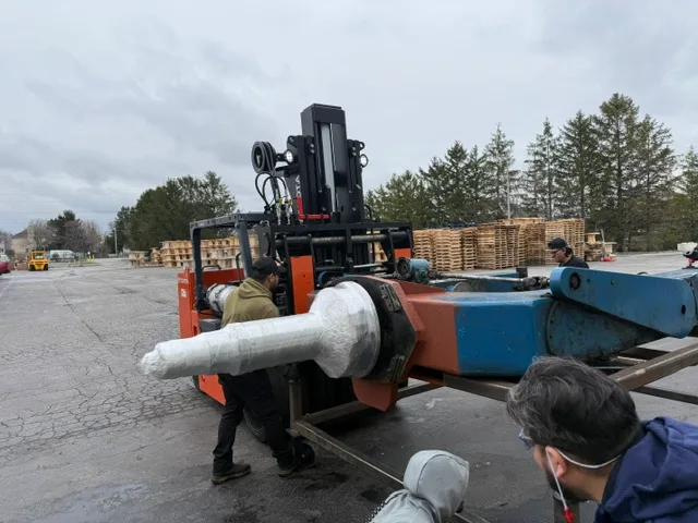 Our crew rigging the failed Rotator 66 assembly to move it into the shop - a 4-ton machine three other welders had turned down.